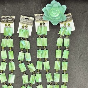 NWT Acrylic Beads.  Each strand has 44 pieces per set. Emerald green in color